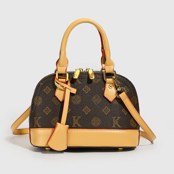 2025 Model Shell Bag. Made of Fashionable PU Material, It Is Decorated with Rivets and Can Be Carried by Hand.6036