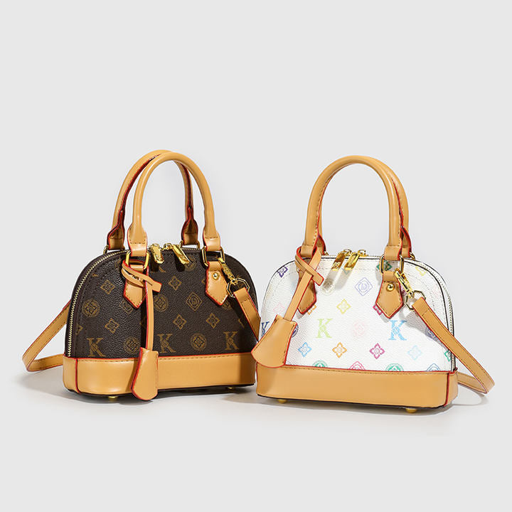 2025 Model Shell Bag. Made of Fashionable PU Material, It Is Decorated with Rivets and Can Be Carried by Hand.6036
